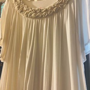 Beautiful flowing top with floral neckline